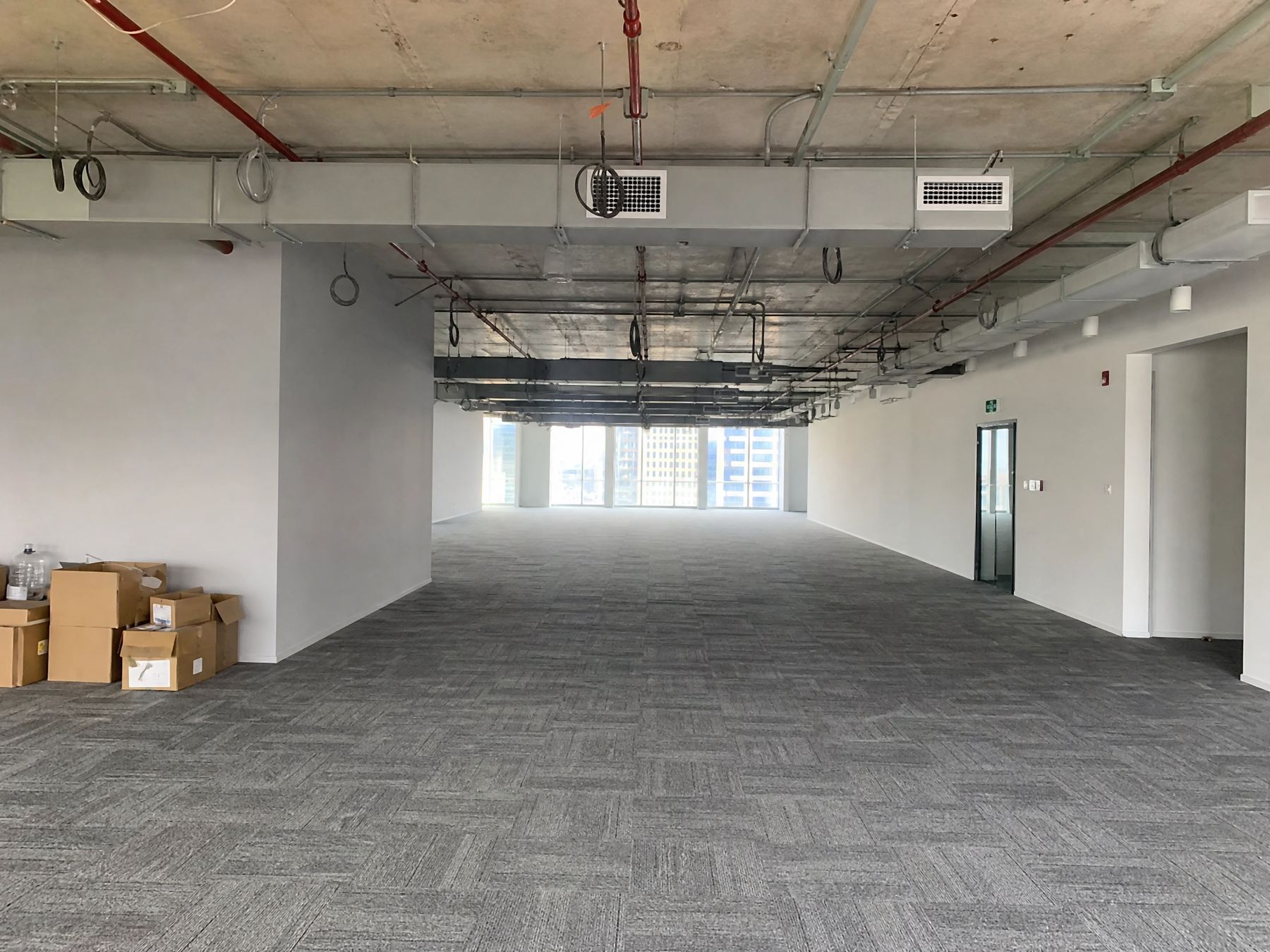 Office floor as found, exposed services and old carpet